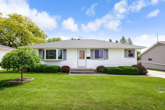 1313 S 26th St, Manitowoc, WI 54220 - ranch-style house with a front lawn and roof with shingles