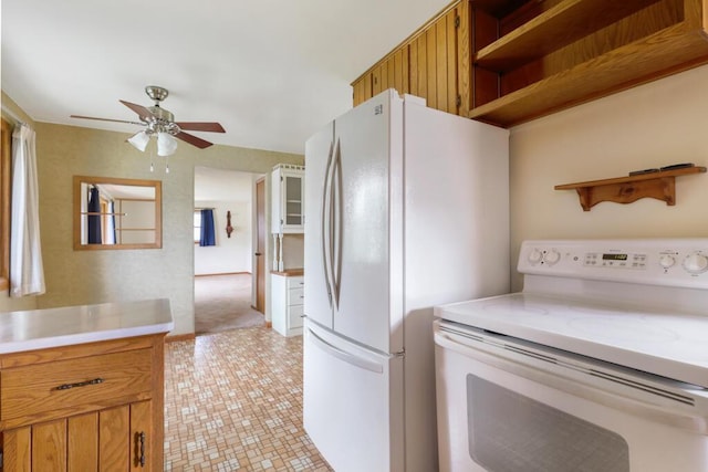 1313 S 26th St, Manitowoc, WI 54220 - kitchen featuring white appliances, open shelves, and light countertops