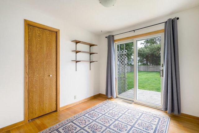 1313 S 26th St, Manitowoc, WI 54220 - unfurnished room with light wood finished floors and baseboards