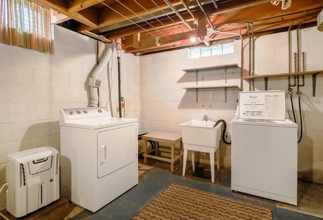 1313 S 26th St, Manitowoc, WI 54220 - laundry area featuring washing machine and dryer and concrete block wall