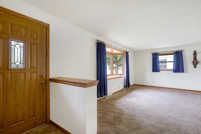 1313 S 26th St, Manitowoc, WI 54220 - foyer with plenty of natural light and carpet flooring