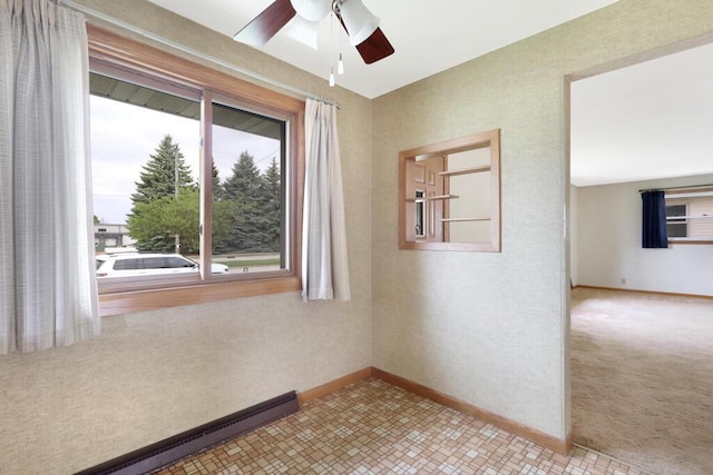 1313 S 26th St, Manitowoc, WI 54220 - unfurnished room with a ceiling fan and a baseboard heating unit