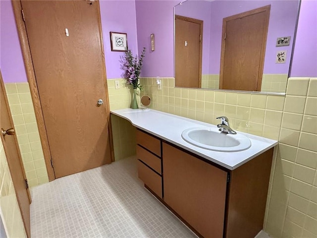 1623 Edgewood Ln, Eau Claire, WI 54703 - bathroom featuring tile walls, vanity, and wainscoting