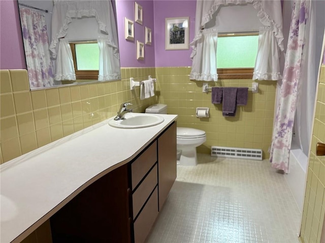 1623 Edgewood Ln, Eau Claire, WI 54703 - bathroom with vanity, shower / bath combination with curtain, wainscoting, tile walls, and tile patterned floors