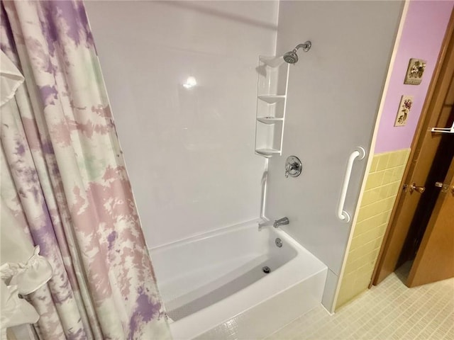 1623 Edgewood Ln, Eau Claire, WI 54703 - bathroom featuring shower / bathtub combination with curtain, tile walls, and tile patterned flooring