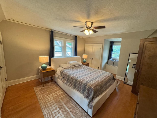 6309 W Mckinley Ave, Wauwatosa, WI 53213 - bedroom with a textured ceiling, wood finished floors, and a ceiling fan