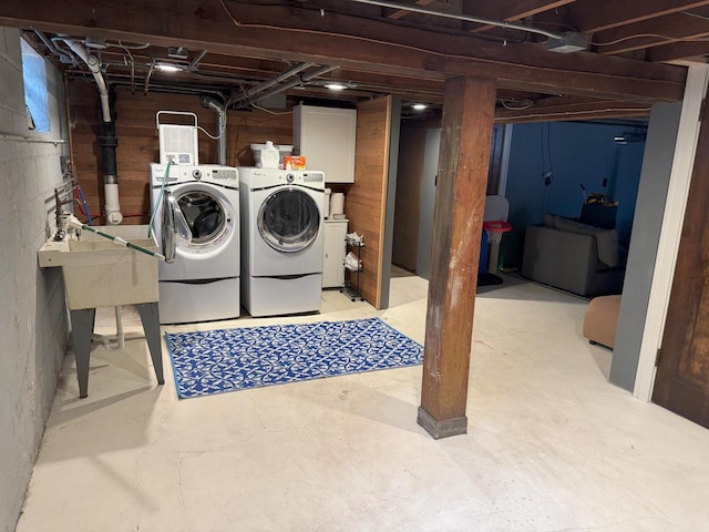 6309 W Mckinley Ave, Wauwatosa, WI 53213 - unfinished below grade area featuring washing machine and dryer and a sink