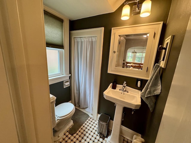 6309 W Mckinley Ave, Wauwatosa, WI 53213 - full bathroom with healthy amount of natural light, a shower with shower curtain, and tile patterned flooring