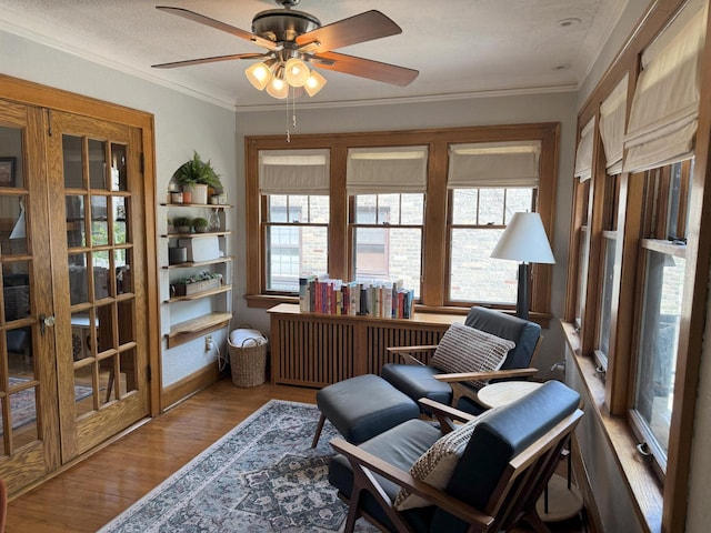 6309 W Mckinley Ave, Wauwatosa, WI 53213 - living area featuring ceiling fan, wood finished floors, and crown molding