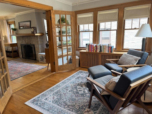 6309 W Mckinley Ave, Wauwatosa, WI 53213 - sitting room featuring ornamental molding, a fireplace with flush hearth, and wood finished floors
