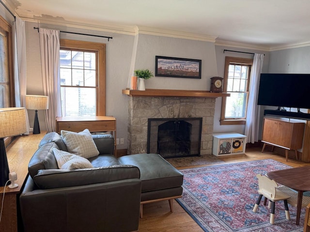 6309 W Mckinley Ave, Wauwatosa, WI 53213 - living area with wood finished floors, a stone fireplace, and ornamental molding
