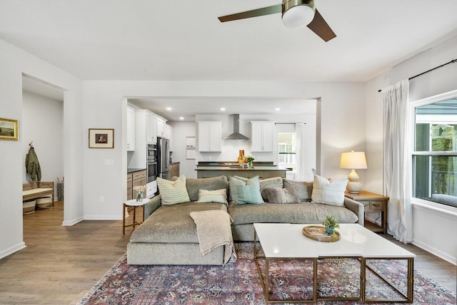 309 Paradise Ct, Hartland, WI 53029 - living room featuring wood finished floors, ceiling fan, and recessed lighting