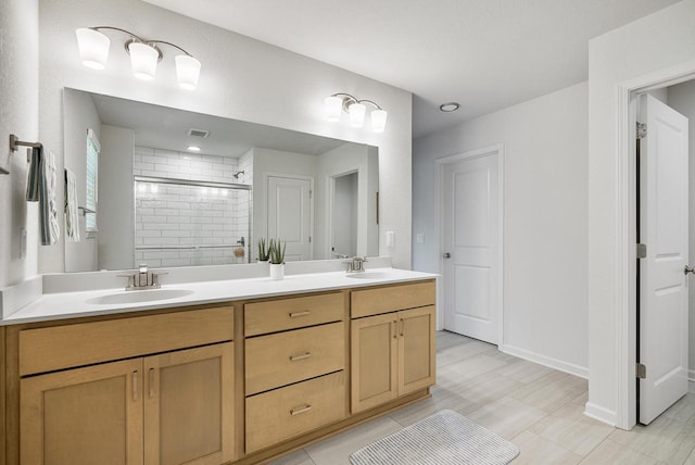 309 Paradise Ct, Hartland, WI 53029 - bathroom featuring a shower stall, double vanity, and tile patterned floors