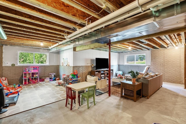309 Paradise Ct, Hartland, WI 53029 - basement featuring brick wall and healthy amount of natural light