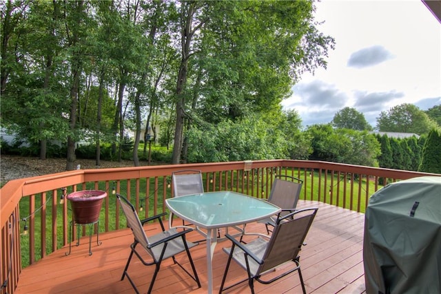 3614 Greendale Ct, Eau Claire, WI 54701 - deck featuring outdoor dining space, a grill, and a yard
