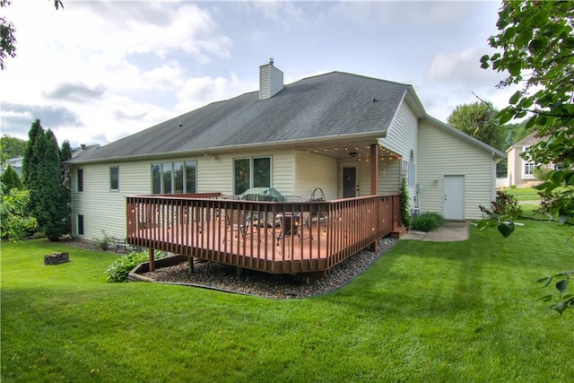 3614 Greendale Ct, Eau Claire, WI 54701 - rear view of house with a wooden deck, a yard, a chimney, and roof with shingles