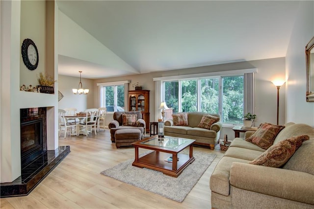 3614 Greendale Ct, Eau Claire, WI 54701 - living room featuring lofted ceiling, light wood-type flooring, and a chandelier