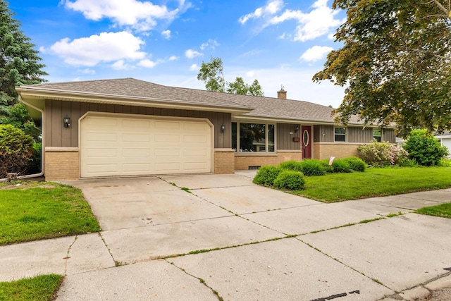 1635 N 21st St, Manitowoc, WI 54220 - ranch-style house with brick siding, board and batten siding, and a chimney