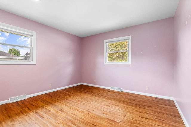 1635 N 21st St, Manitowoc, WI 54220 - empty room featuring light wood-type flooring and baseboards