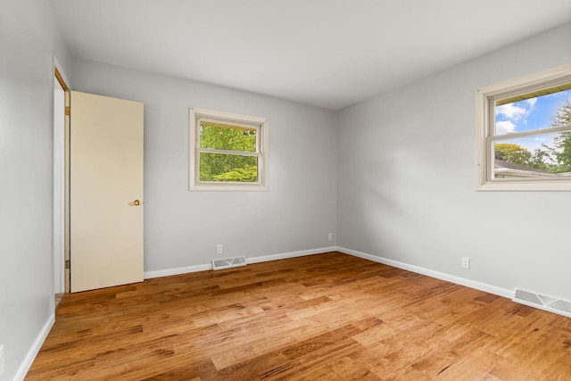 1635 N 21st St, Manitowoc, WI 54220 - empty room featuring light wood finished floors and baseboards