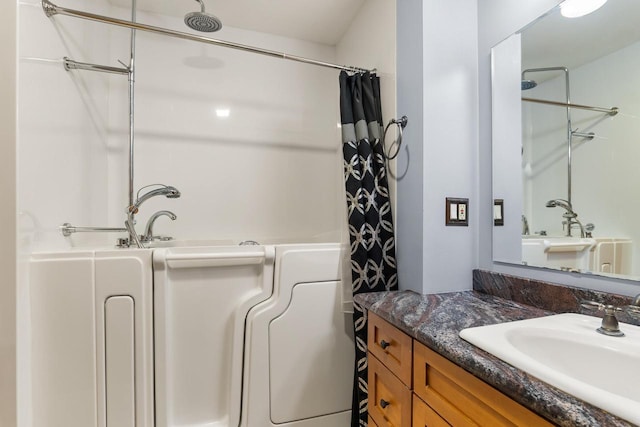1635 N 21st St, Manitowoc, WI 54220 - bathroom featuring vanity and curtained shower