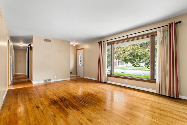 1635 N 21st St, Manitowoc, WI 54220 - unfurnished room featuring light wood-type flooring and baseboards