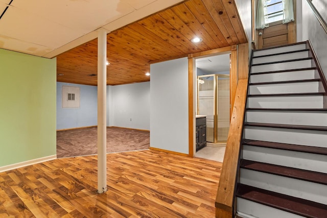 1635 N 21st St, Manitowoc, WI 54220 - finished basement featuring wood finished floors, stairs, recessed lighting, carpet floors, and wooden ceiling
