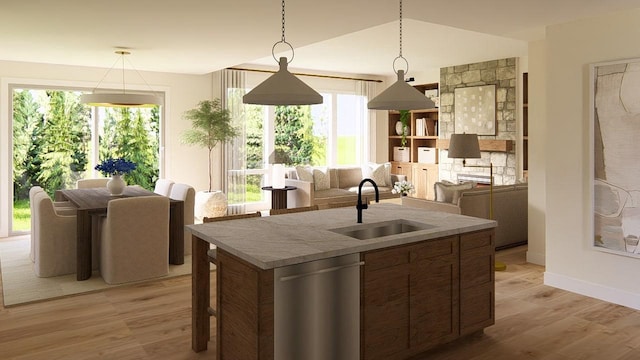 905 Westbridge Ct, Waunakee, WI 53597 - kitchen with stainless steel dishwasher, light wood-type flooring, an island with sink, lofted ceiling, and decorative light fixtures
