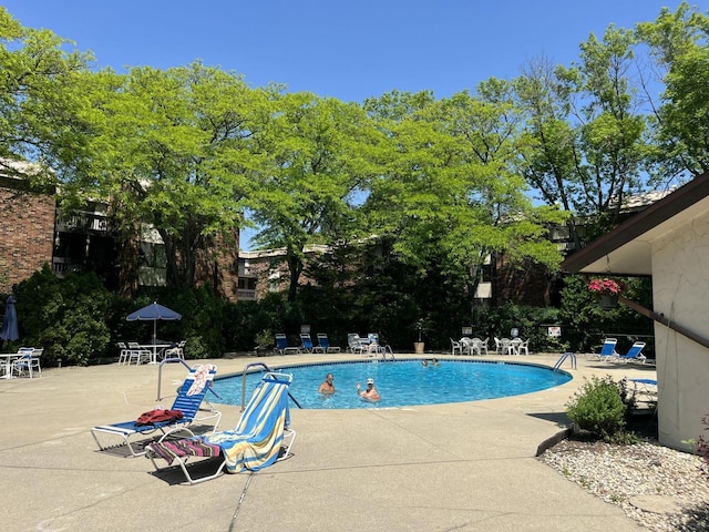2200 W Good Hope Rd Unit 115, Glendale, WI 53209 - community pool featuring a patio