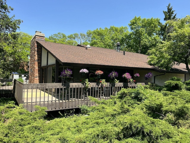 2200 W Good Hope Rd Unit 115, Glendale, WI 53209 - rear view of house featuring a chimney, a wooden deck, and roof with shingles