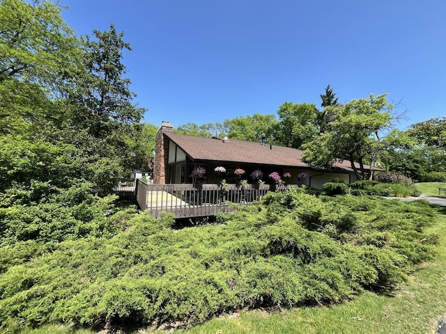 2200 W Good Hope Rd Unit 115, Glendale, WI 53209 - view of side of home featuring a chimney and a deck