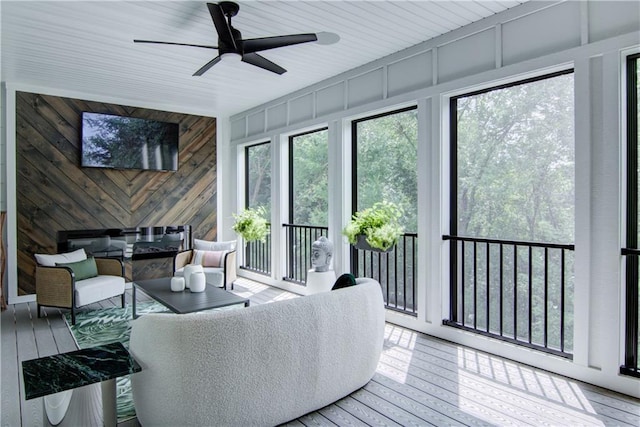 6649 Hope Ln, Eau Claire, WI 54701 - sunroom / solarium with hardwood / wood-style flooring, wooden walls, and a deck