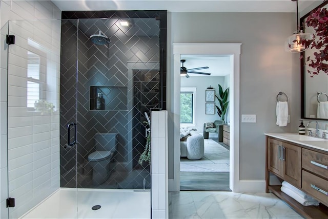 6649 Hope Ln, Eau Claire, WI 54701 - ensuite bathroom with marble look tiles, vanity, a shower stall, and ceiling fan