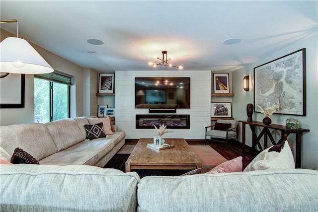 6649 Hope Ln, Eau Claire, WI 54701 - living area featuring wood finished floors and a glass covered fireplace