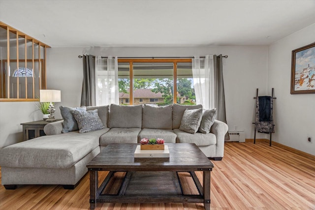 9230 W Auer Ave, Milwaukee, WI 53222 - living room featuring baseboard heating and light wood finished floors