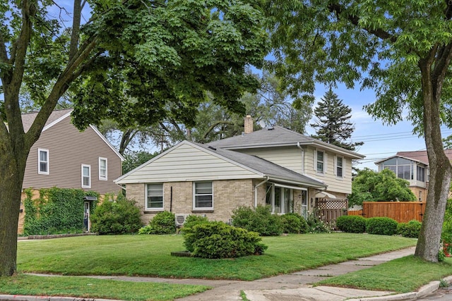 9230 W Auer Ave, Milwaukee, WI 53222 - view of front facade featuring a chimney and brick siding