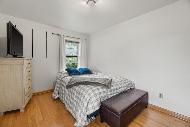 9230 W Auer Ave, Milwaukee, WI 53222 - bedroom with light wood-type flooring