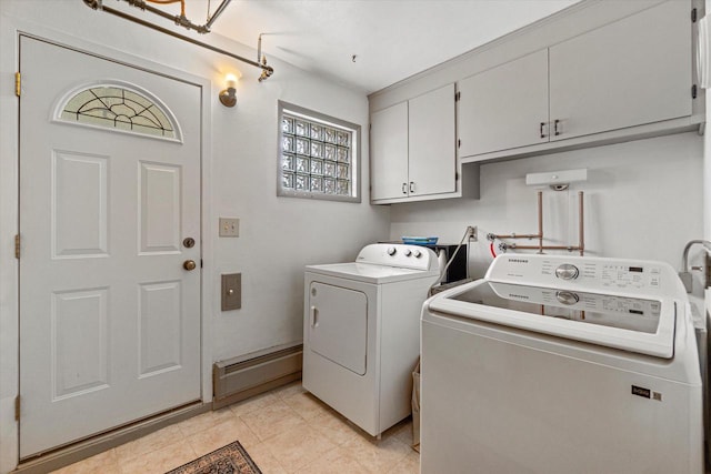 9230 W Auer Ave, Milwaukee, WI 53222 - laundry area featuring cabinet space, washing machine and clothes dryer, a baseboard radiator, and light tile patterned floors