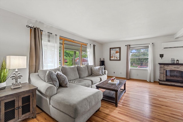 9230 W Auer Ave, Milwaukee, WI 53222 - living area featuring a wall mounted AC, healthy amount of natural light, and light wood finished floors