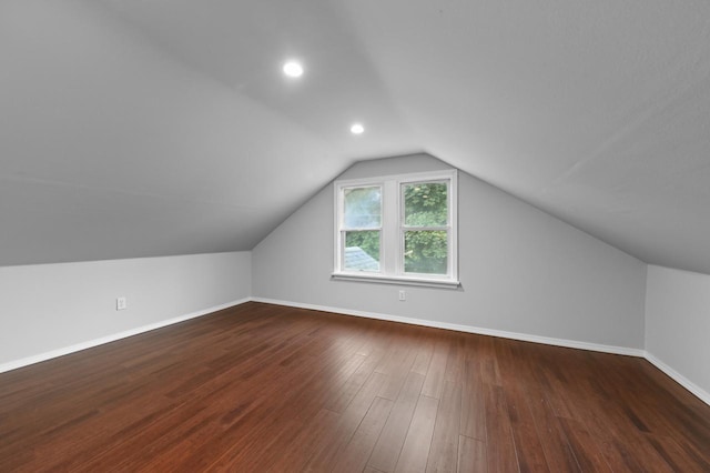 203 N 71st St, Milwaukee, WI 53213 - additional living space with vaulted ceiling and dark wood-type flooring