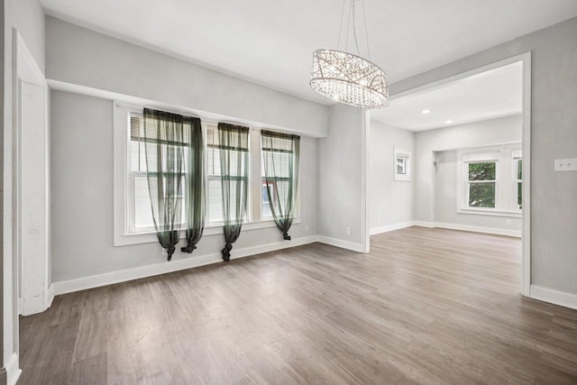 3936 N 14th St Unit 3938, Milwaukee, WI 53206 - unfurnished room with a chandelier, wood finished floors, and recessed lighting