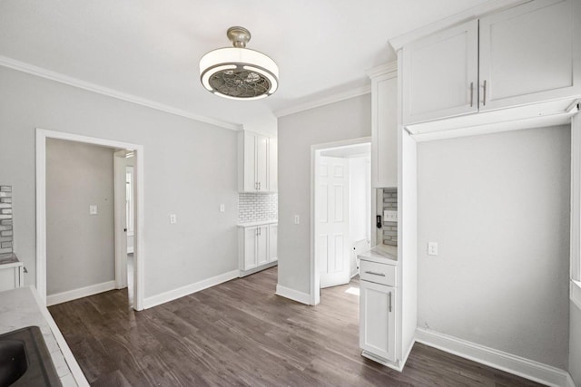 3936 N 14th St Unit 3938, Milwaukee, WI 53206 - unfurnished dining area featuring crown molding and dark wood-style floors