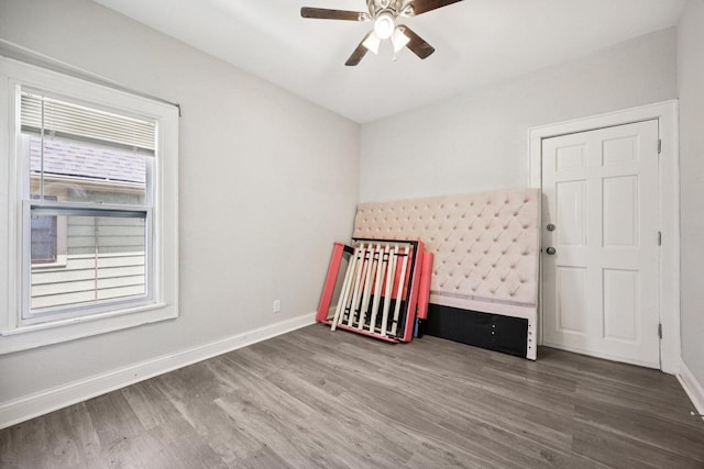 3936 N 14th St Unit 3938, Milwaukee, WI 53206 - unfurnished bedroom featuring wood finished floors, a nursery area, and ceiling fan