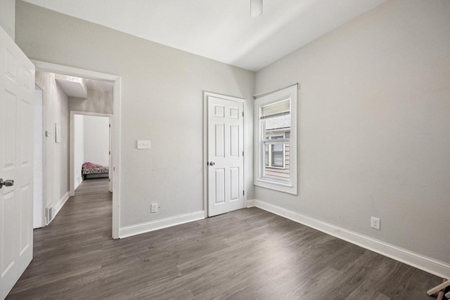 3936 N 14th St Unit 3938, Milwaukee, WI 53206 - unfurnished bedroom with dark wood-style flooring and a closet