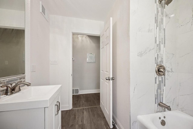 3936 N 14th St Unit 3938, Milwaukee, WI 53206 - full bath featuring vanity, wood finished floors, and shower / tub combination