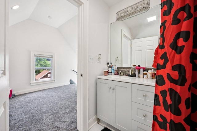 3936 N 14th St Unit 3938, Milwaukee, WI 53206 - full bathroom featuring vanity, tasteful backsplash, lofted ceiling, and a shower with shower curtain