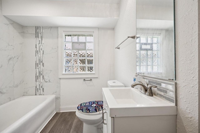 3936 N 14th St Unit 3938, Milwaukee, WI 53206 - bathroom featuring wood finished floors, vanity, and washtub / shower combination