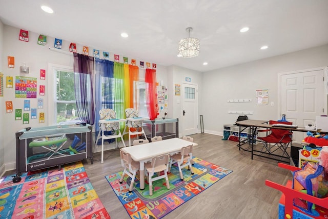 3936 N 14th St Unit 3938, Milwaukee, WI 53206 - game room with wood finished floors, recessed lighting, and a chandelier