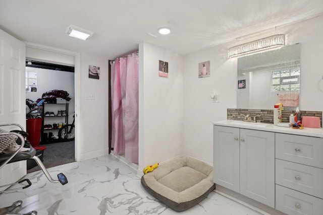3936 N 14th St Unit 3938, Milwaukee, WI 53206 - full bath featuring marble look tiles, vanity, decorative backsplash, and curtained shower