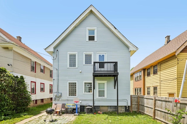 3936 N 14th St Unit 3938, Milwaukee, WI 53206 - rear view of property featuring a balcony and a patio